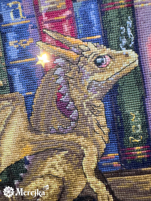 The Moth Hunters K-266 Counted Cross-Stitch Kit with two dragons on the bookshelf