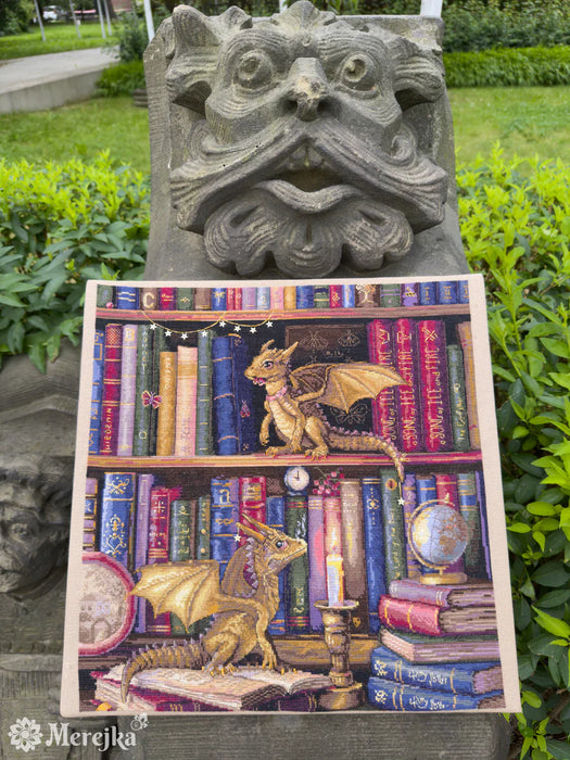The Moth Hunters K-266 Counted Cross-Stitch Kit with two dragons on the bookshelf